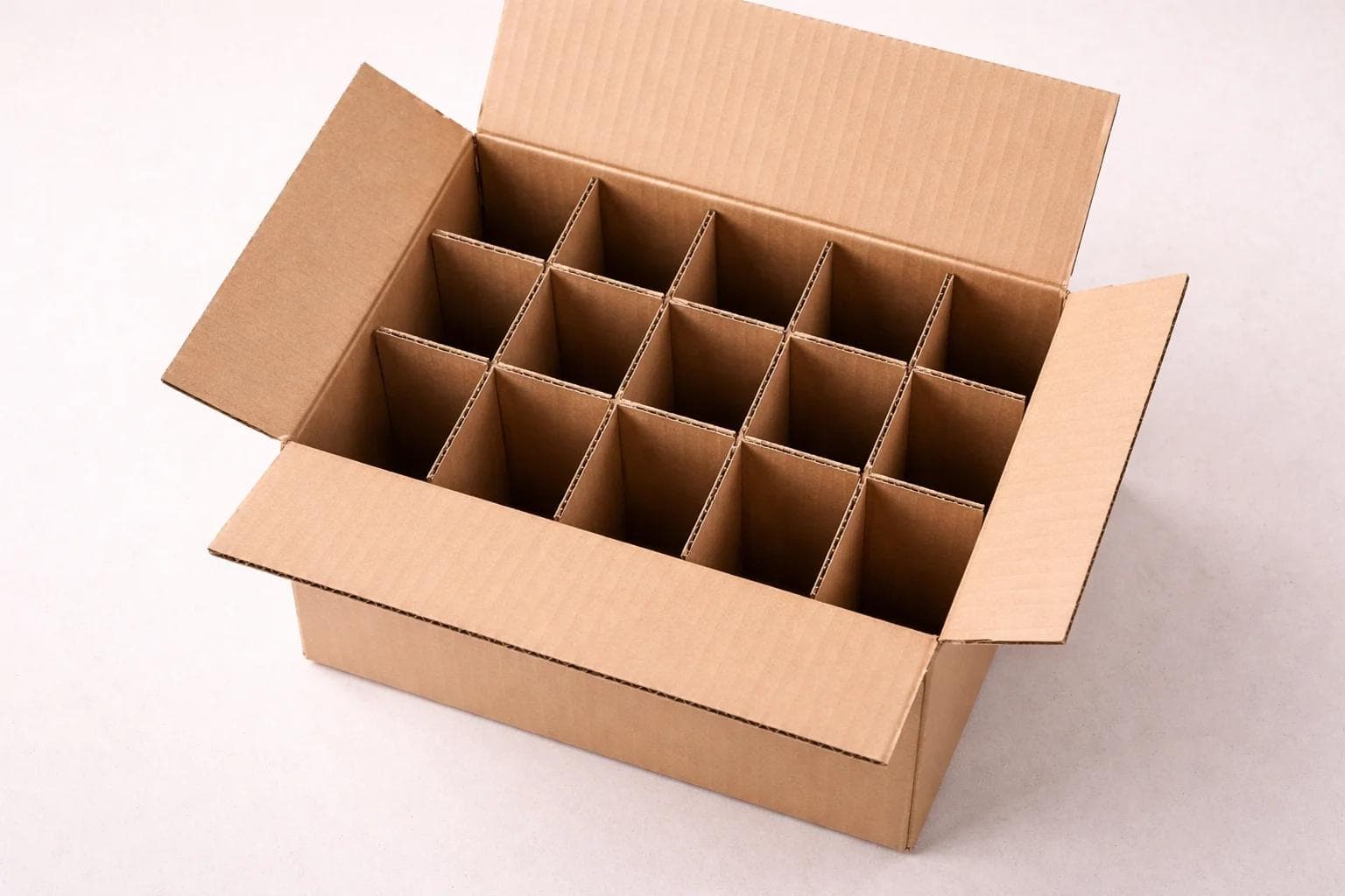 Top-down view of a shipping box with corrugated divider cells inside